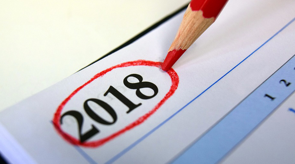The number 2018 circled with red pencil at the top of a calendar
